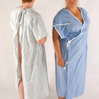 This is an undated handout made available from the North Bristol National Health Service Trust in western England on Tuesday Feb. 9, 2010 of the new hospital gown, right, which protects patients' "dignity and privacy" by keeping their bottoms covered up, and the old gown, left. Traditional robes which fasten at the back can expose the rear - so two Bristol hospitals are phasing them out in favour of the new "dignity gowns". The more modest model,  ties up at the sides and wraps around the body.  (AP Photos/North Bristol NHS Trust/PA)  **  UNITED KINGDOM OUT NO SALES   **